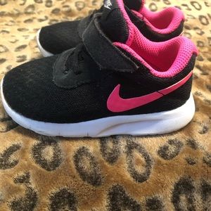 Pink and black toddler Nike sneakers